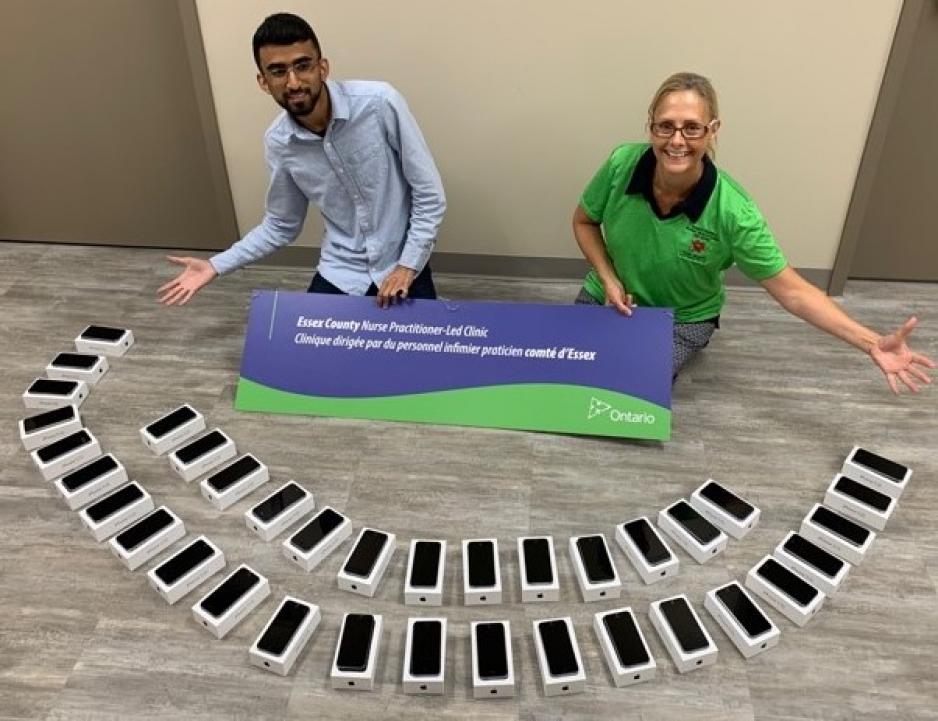 Two Essex County NPLC staff show some of the devices to be used in the lending program